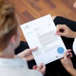 Kym explaining the Certificate of Valuation of a client's diamond engagement ring