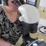 Ms Wong examining a brilliant cut diamond in her gemmological laboratory in Richmond