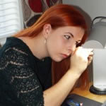 Karra carrying out a preliminary examination of a diamond ring at a client's home.