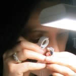 Kehan carrying out a preliminary examination of a diamond ring