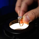 Jeff  Allinson examining a brilliant cut diamond at Accredited Jewelry Appraisers LLC.