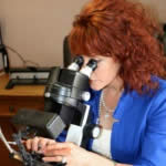 Tracy Lee Aros identifying a gemstone prior to quality assessment and valuation