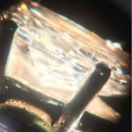 Part of appraising gemstones and diamonds is identifying any treatments that may be present that not only alter the appearance but the value too. This diamond has been laser-drilled to improve its clarity.