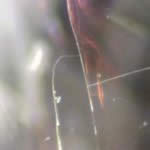 This lab not only identifies gemstones but also identifies and quantifies any treatments that have been applied to improve the gem. Here is shown a diamond that has been fracture-filled using hi-tech optical glasses