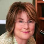 Carole using a darkfield gemological microscope to examine inclusions inside gemstones.