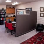 Part of Carole's office showing the client waiting area, consultation desk and library.